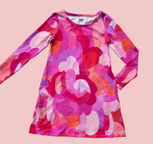 Colorful long-sleeve dress with abstract pattern on a white background