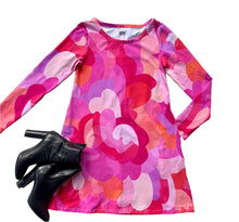 Colorful patterned dress with long sleeves on a white background